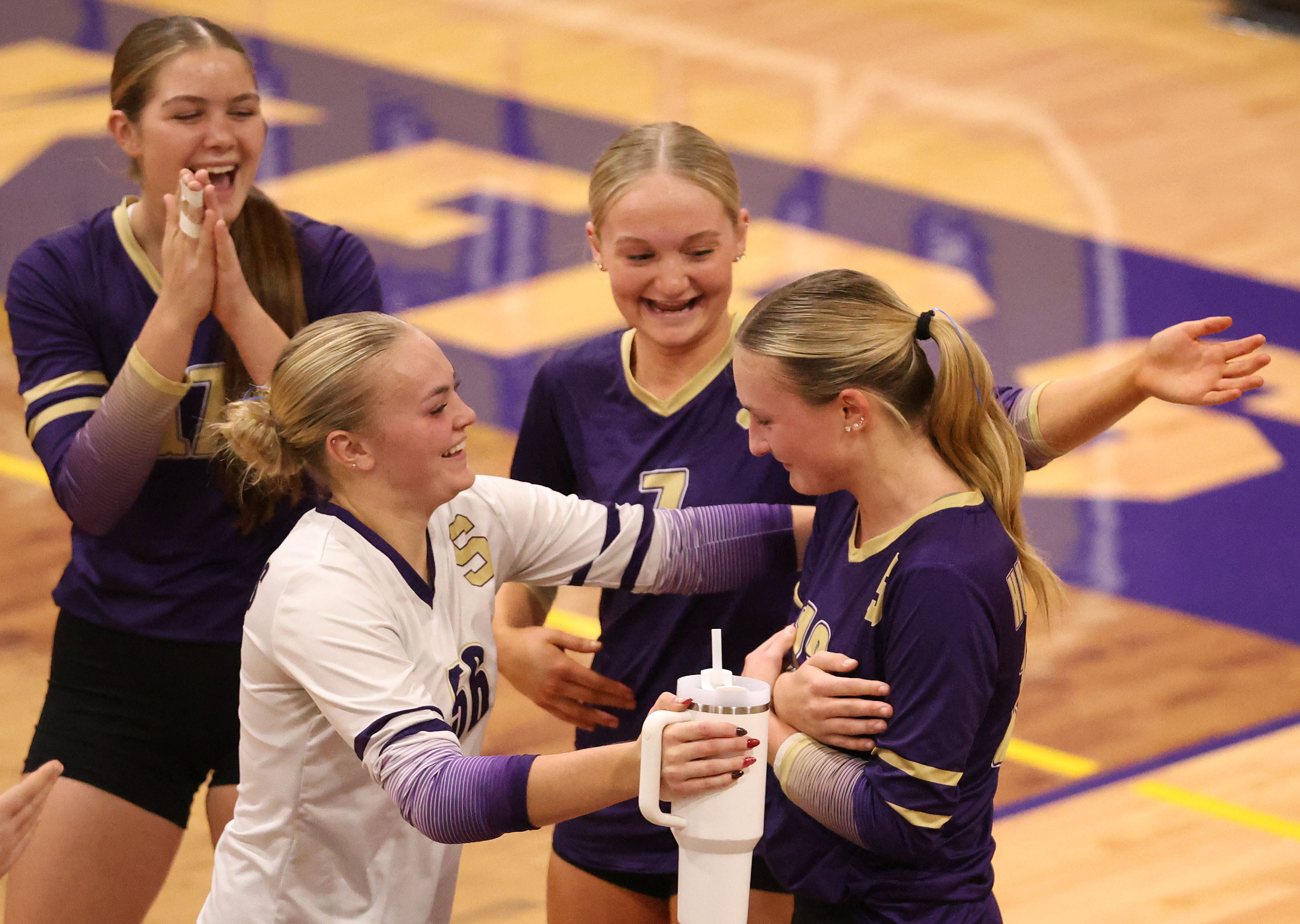 Serena High School volleyball team celebrates their Class 1A Regional quarterfinal victory over Somonauk.
